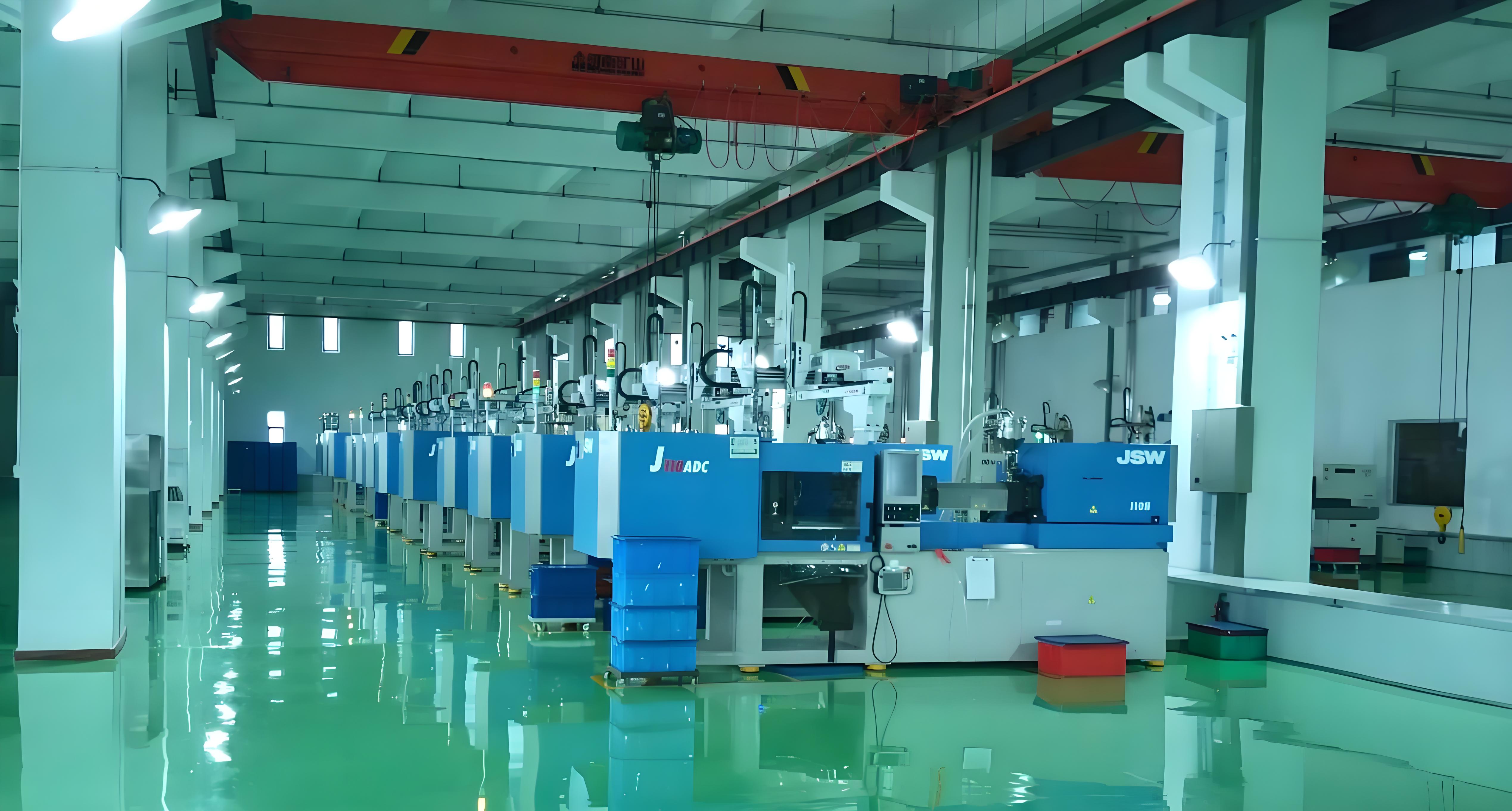 A modern injection molding factory with a row of injection molding machines in a clean and organized environment.