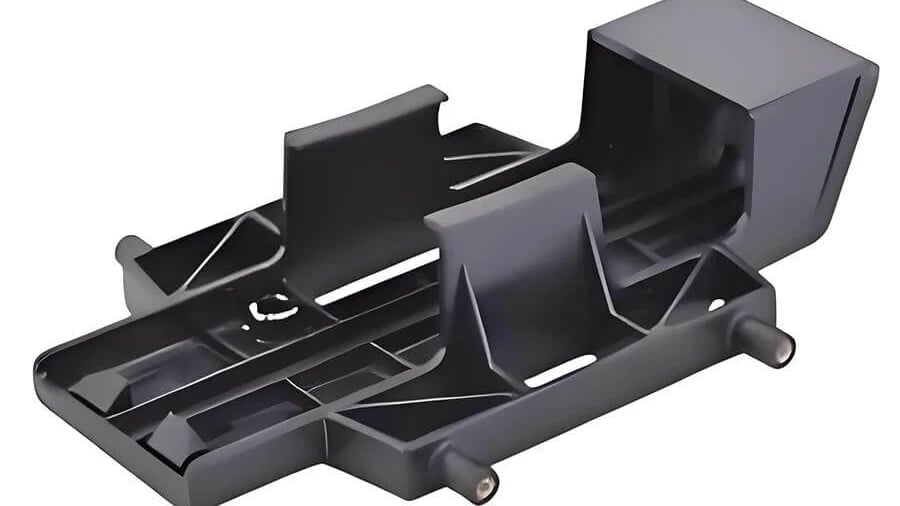 Black plastic support component with cutouts and elevated sections