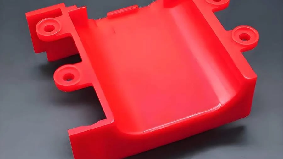 Bright red plastic component for machinery or automotive use