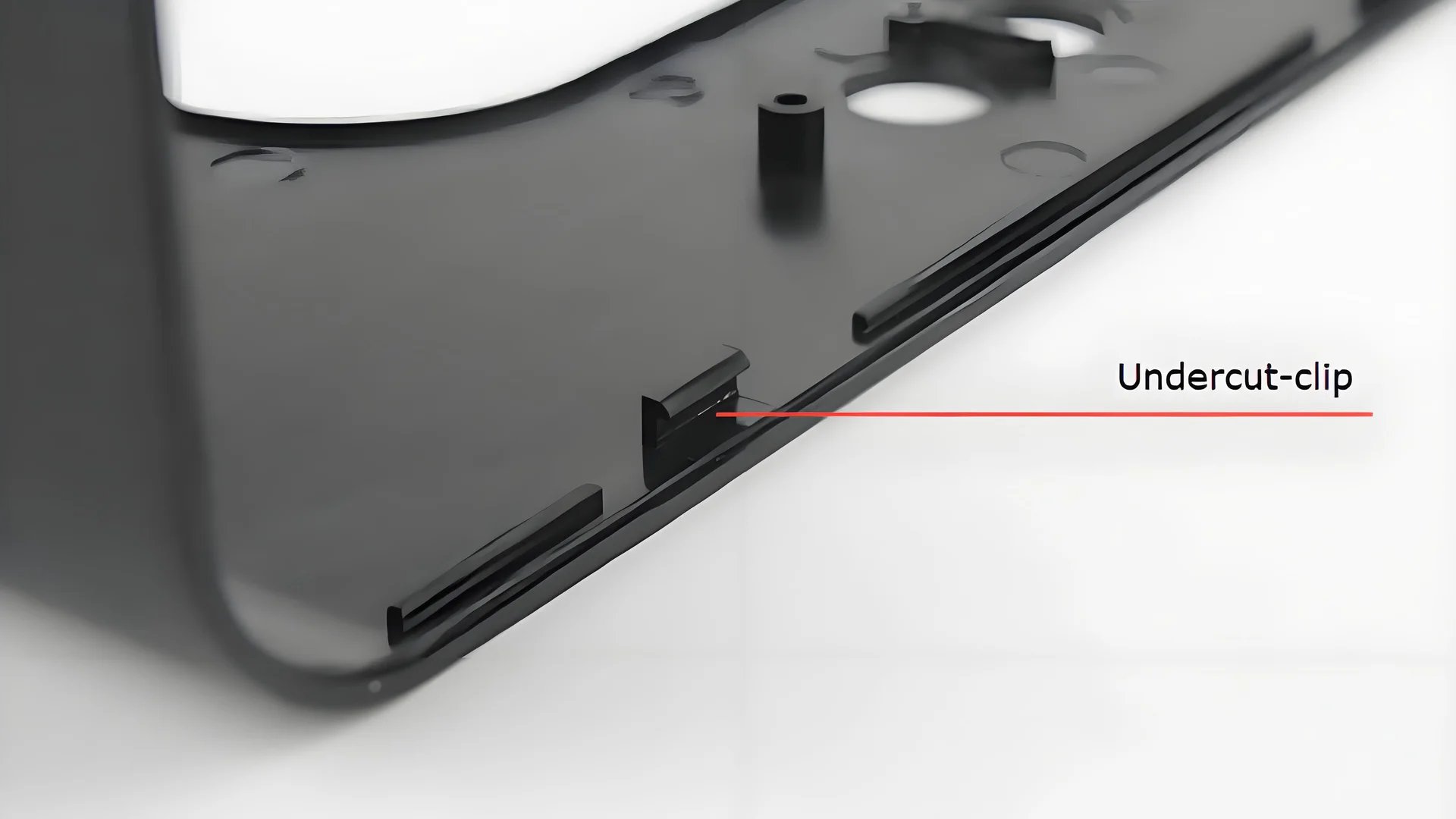 Lifter mechanism in injection molding with a close-up view of a plastic part being ejected from the mold.