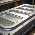 Close-up of an injection molded plastic part showing parting line details