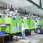 Manufacturing facility with injection molding machines and workers