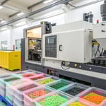 Modern injection molding machine in a bright workshop