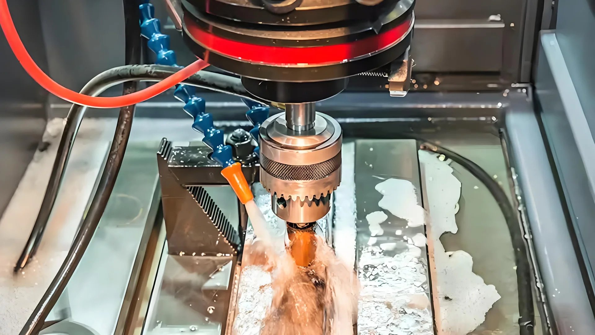 EDM machine cutting metal mold in a workshop