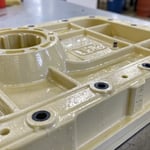 Close-up of a plastic component with gas marks