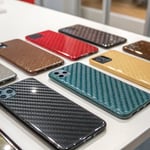 A display of injection-molded product samples with various finishes