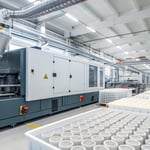 A modern industrial injection molding machine in a factory