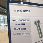 Photorealistic illustration of a screw boss design diagram with labeled dimensions.