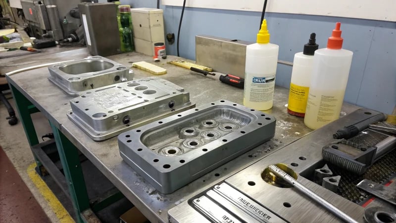 A workshop scene with injection molded parts undergoing plating