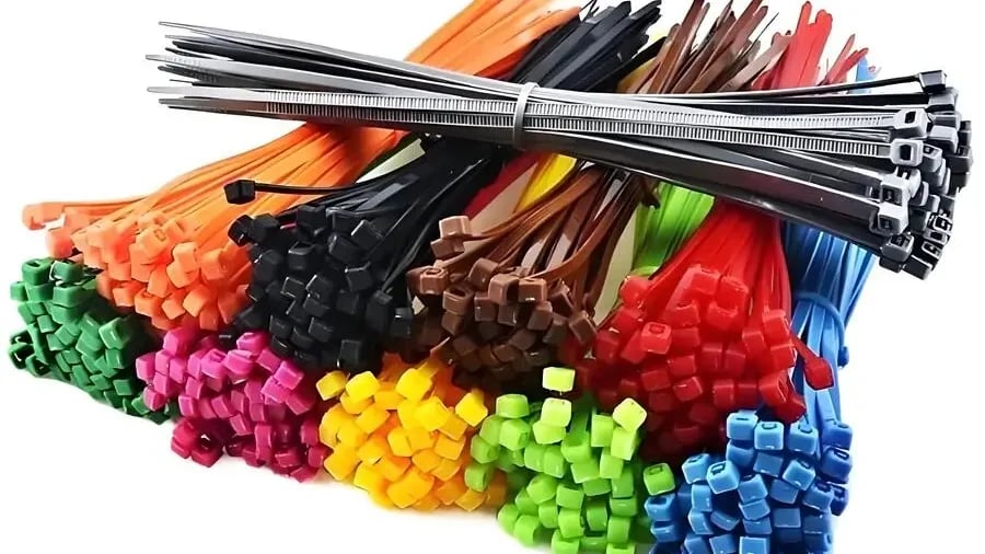 An organized display of colorful nylon cable ties on a smooth surface
