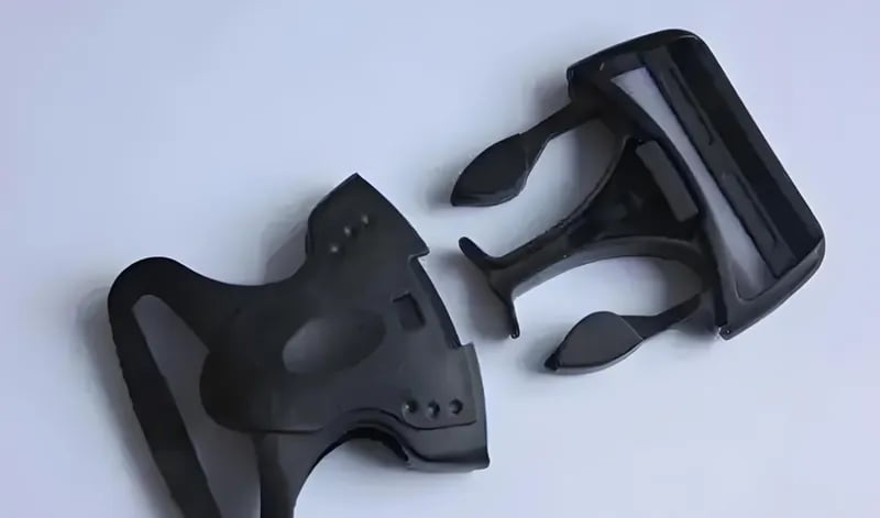 A black plastic 3D printed wrench with two separate pieces shown