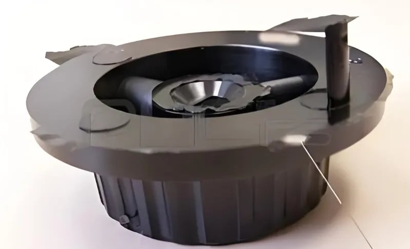 A black round ceiling air diffuser with secure stream design